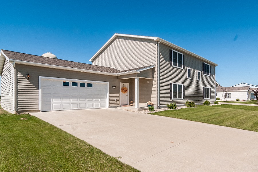 a house with a driveway and a garage door